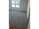 Bedroom featuring neutral carpet and a large window providing natural light at 1235 Island Slough Ln, Davenport, FL 33837