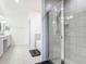 Bathroom featuring walk-in shower, soaker tub, neutral tile, and dual vanity at 1314 Victory Palm Dr, Edgewater, FL 32132