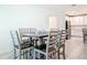 Dining area with modern table and chairs, open to the kitchen and living room at 1314 Victory Palm Dr, Edgewater, FL 32132