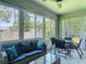 Inviting sunroom with abundant natural light and comfortable seating, perfect for relaxation at 1314 Victory Palm Dr, Edgewater, FL 32132