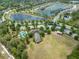 Beautiful aerial view of a community with tranquil lakes, a swimming pool, and well-maintained landscaping at 1354 Riley Cir, Deland, FL 32724