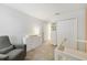 Well lit Bedroom features carpeted floors, crib, modern dresser, reading chair and closet at 1354 Riley Cir, Deland, FL 32724