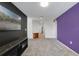Long hallway features fresh paint, lighting, neutral carpet and leads to other living areas at 1354 Riley Cir, Deland, FL 32724