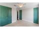 Bedroom with plush carpeting and green painted double door access to other rooms at 13798 Walcott Ave, Orlando, FL 32827