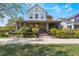 Charming two-story home with a cozy front porch and meticulously manicured landscaping at 13798 Walcott Ave, Orlando, FL 32827