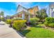 Attractive two-story house showing vibrant landscaping and a cozy front porch at 13798 Walcott Ave, Orlando, FL 32827