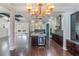 Open concept kitchen with island, modern appliances, and hardwood floors at 13798 Walcott Ave, Orlando, FL 32827