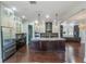 Large kitchen with spacious island, custom cabinetry, and stainless steel appliances at 13798 Walcott Ave, Orlando, FL 32827