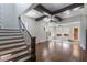 Bright living room with hardwood floors, ceiling beams, and many windows at 13798 Walcott Ave, Orlando, FL 32827