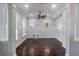 Living room with hardwood floors, recessed lighting, wainscoting and an abundance of natural light at 13798 Walcott Ave, Orlando, FL 32827
