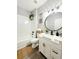 Bathroom featuring a tub and shower combo and an updated vanity at 14521 Tanja King Blvd, Orlando, FL 32828