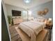 Inviting bedroom featuring natural light, decorative wall art, and stylish furnishings at 14521 Tanja King Blvd, Orlando, FL 32828