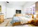 Comfortable bedroom featuring a window with blinds, hardwood floors, and closet at 14521 Tanja King Blvd, Orlando, FL 32828