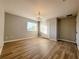 Spacious bedroom featuring hard wood floors, a closet, and a window at 14521 Tanja King Blvd, Orlando, FL 32828