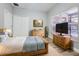 Bedroom with a light blue color scheme, window, and tv on the wall at 14521 Tanja King Blvd, Orlando, FL 32828