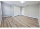 Bright bedroom with a closet, neutral paint, and wood-look flooring at 14521 Tanja King Blvd, Orlando, FL 32828