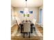 Dining room featuring a geometric light fixture and stylish table setting with a modern rug at 14521 Tanja King Blvd, Orlando, FL 32828