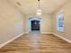 Bright dining room with new floors and a modern light fixture at 14521 Tanja King Blvd, Orlando, FL 32828
