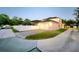Side and rear view of home with attached garage, fenced yard, and screened in patio at 14521 Tanja King Blvd, Orlando, FL 32828