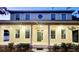 Two-story home with classic architectural details including columns and a round window detail on the second story at 14521 Tanja King Blvd, Orlando, FL 32828