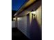 Exterior view of the home's garage with an external light fixture at 14521 Tanja King Blvd, Orlando, FL 32828