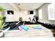 Home gym featuring exercise equipment, yoga mats and a mirror at 14521 Tanja King Blvd, Orlando, FL 32828