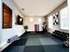 Bright home gym with exercise bike, weights, and yoga mats at 14521 Tanja King Blvd, Orlando, FL 32828