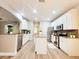 Bright kitchen with white cabinets, stainless steel appliances, and granite countertops at 14521 Tanja King Blvd, Orlando, FL 32828