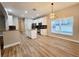 Kitchen with center island, stainless appliances and modern light fixture at 14521 Tanja King Blvd, Orlando, FL 32828