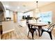 Bright eat-in kitchen with modern appliances, center island, and stylish light fixture at 14521 Tanja King Blvd, Orlando, FL 32828