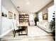 Office and den featuring a bookshelf, desk, and a comfy couch at 14521 Tanja King Blvd, Orlando, FL 32828