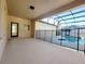 Covered patio featuring a screened-in pool area with a safety fence for protection at 14521 Tanja King Blvd, Orlando, FL 32828