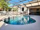 Inviting screened pool with tile trim at 14521 Tanja King Blvd, Orlando, FL 32828