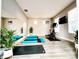 Bright workout room with a large mirror, modern exercise equipment, and blue yoga mats on stylish gray floors at 14521 Tanja King Blvd, Orlando, FL 32828