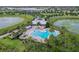Aerial view of community pool, amenities, and lush landscaping, offering resort-style living at 14738 Porter Rd, Winter Garden, FL 34787