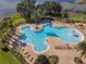 Stunning aerial view of the community pool, with ample seating and a splash fountain at 14738 Porter Rd, Winter Garden, FL 34787