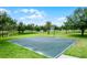 Outdoor basketball court in a well-maintained community with surrounding trees at 14738 Porter Rd, Winter Garden, FL 34787