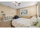 Bedroom featuring plantation shutters, ceiling fan, and seating area offers a comfortable and inviting space at 14738 Porter Rd, Winter Garden, FL 34787