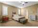 Bedroom with tan walls, carpeted flooring, and plantation shutters at 14738 Porter Rd, Winter Garden, FL 34787