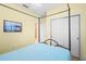 Bedroom featuring canopy bed and double sliding door closet with ample storage space at 14738 Porter Rd, Winter Garden, FL 34787