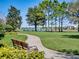 Picturesque community park with walking path, benches, and scenic lake views at 14738 Porter Rd, Winter Garden, FL 34787