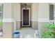 Close-up view of the elegant front door, showcasing the inviting entryway and architectural details at 14738 Porter Rd, Winter Garden, FL 34787