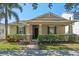Charming single-story home with a manicured front yard and inviting covered porch at 14738 Porter Rd, Winter Garden, FL 34787
