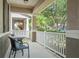 Relaxing front porch with seating area and views of the landscaped neighborhood at 14738 Porter Rd, Winter Garden, FL 34787