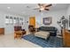 Comfortable living room features an area rug, ceiling fan, and well-lit space for relaxation and gatherings at 14738 Porter Rd, Winter Garden, FL 34787