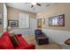 This room features a comfortable seating area, complemented by tasteful decor, and plantation shutters allowing natural light at 14738 Porter Rd, Winter Garden, FL 34787