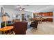 Expansive living room and kitchen featuring tile floors, and comfortable seating arrangements at 14738 Porter Rd, Winter Garden, FL 34787