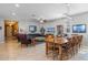 Spacious living and dining area with tile flooring, ceiling fan, and ample natural light, great for entertaining at 14738 Porter Rd, Winter Garden, FL 34787