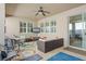 Comfortable covered patio featuring an outdoor seating area, ceiling fan, and sliding glass door at 14738 Porter Rd, Winter Garden, FL 34787