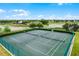 Aerial view of well-maintained tennis courts in a landscaped community setting at 14738 Porter Rd, Winter Garden, FL 34787